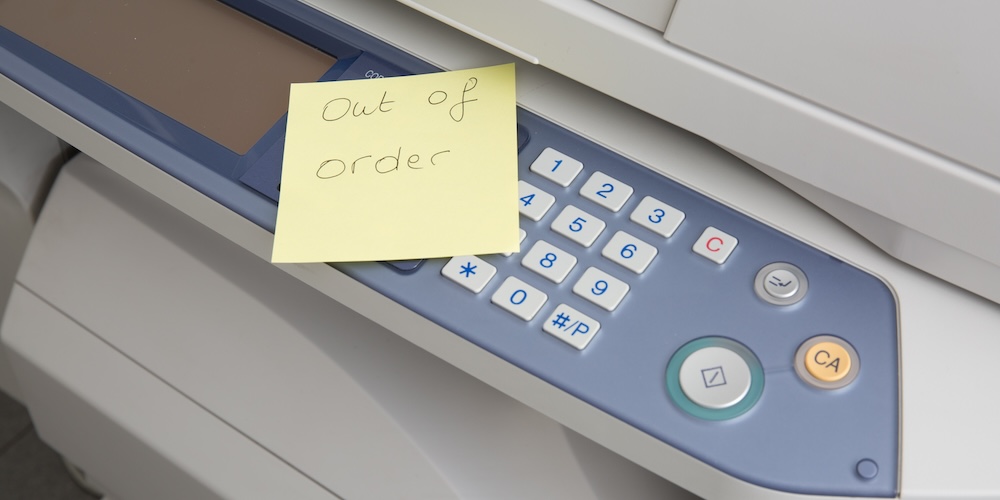 photocopy machine with note indication that out of order