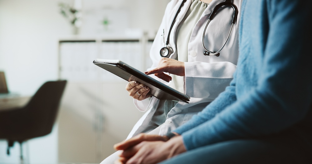 Hands, doctor and patient with tablet, explain and conversation with feedback for diagnosis.