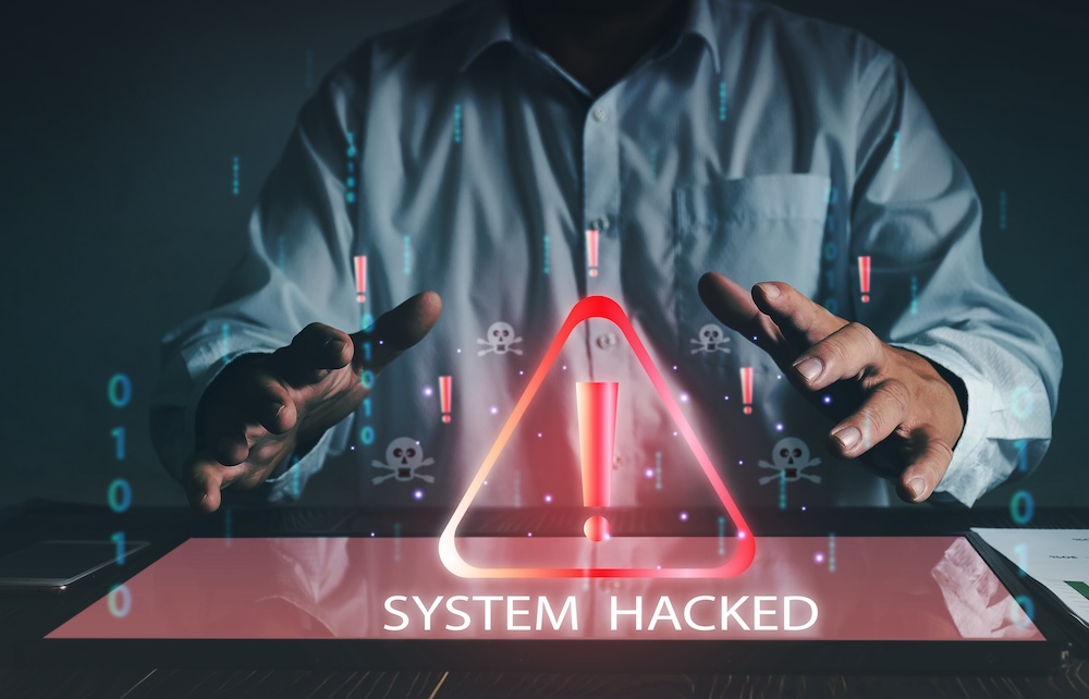 Businessman using computer laptop, System warning hacked alertsign for notification error personal data hacking virus cybercrime.concept Cybersecurity vulnerability computer network.