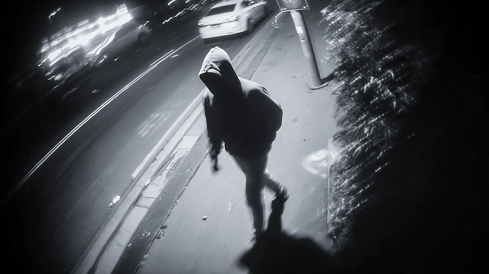 footage taken from a video camera of a mysterious figure.