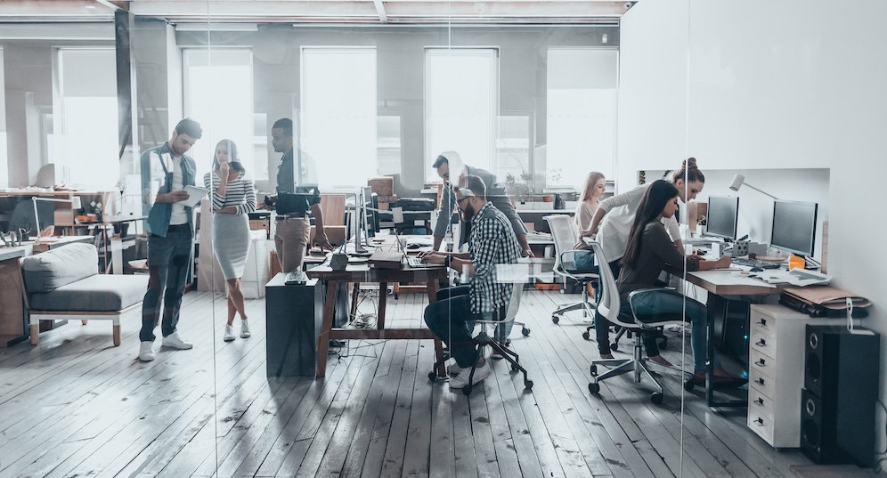 Team at work. Group of young business people in smart casual wear working together in creative office. Not having to worry about security.