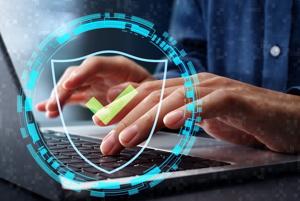 Zero trust security model and architecture. Access control through user authentication and identity verification. Businessman using laptop computer with device authentication and secure access management.