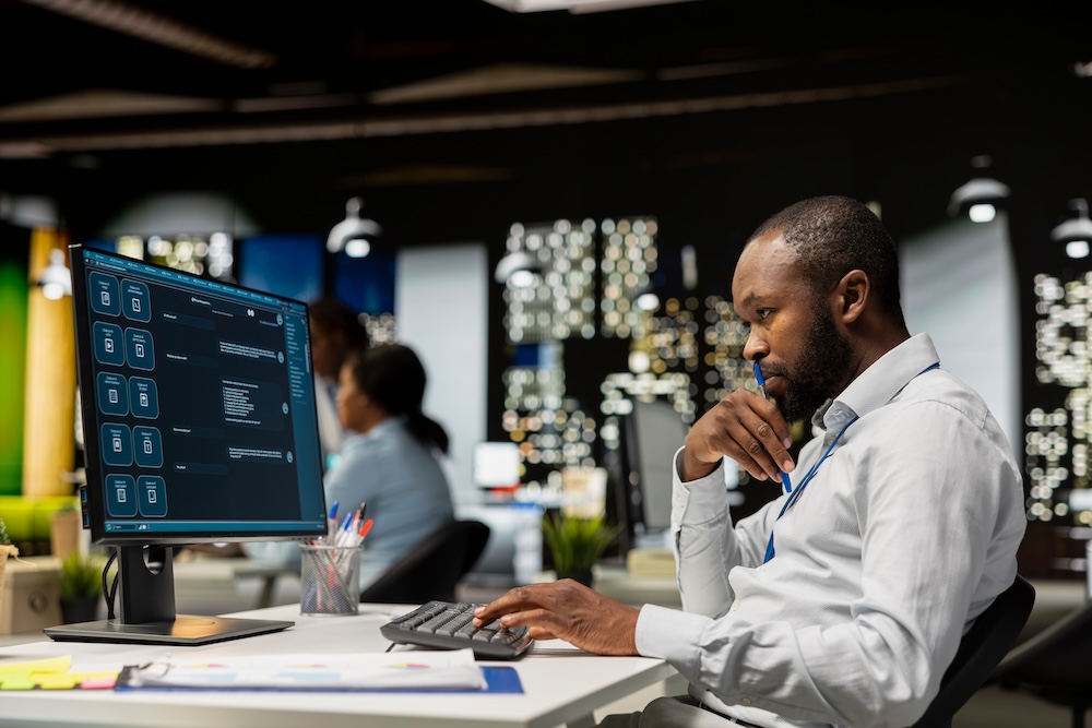 Business professional using AI-powered business software to improve productivity and decision-making.